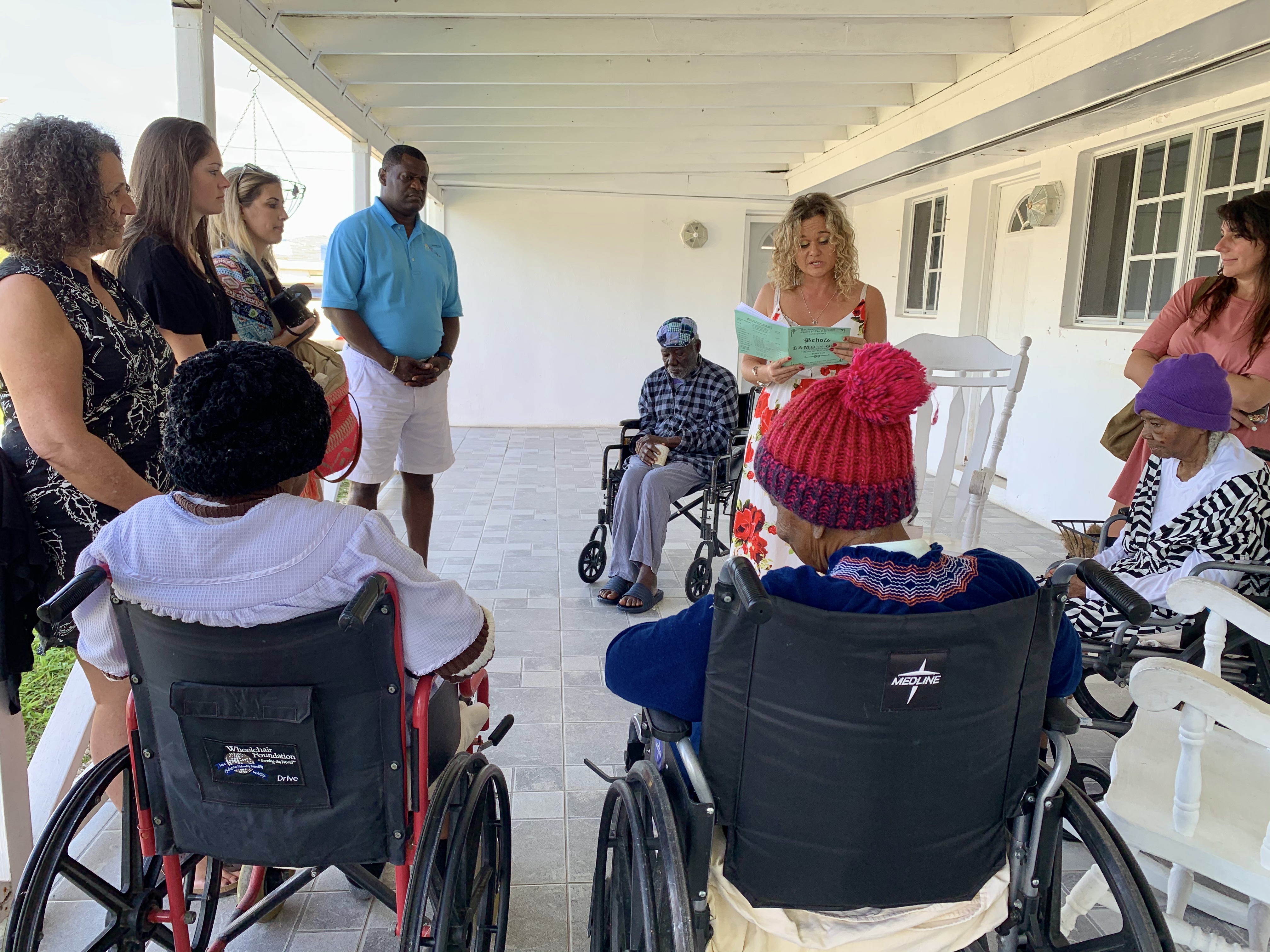 The familiarization tour included a stop to the Grand Bahama Home for the Aged where the visitors spent time reading and socializing with the residents.
