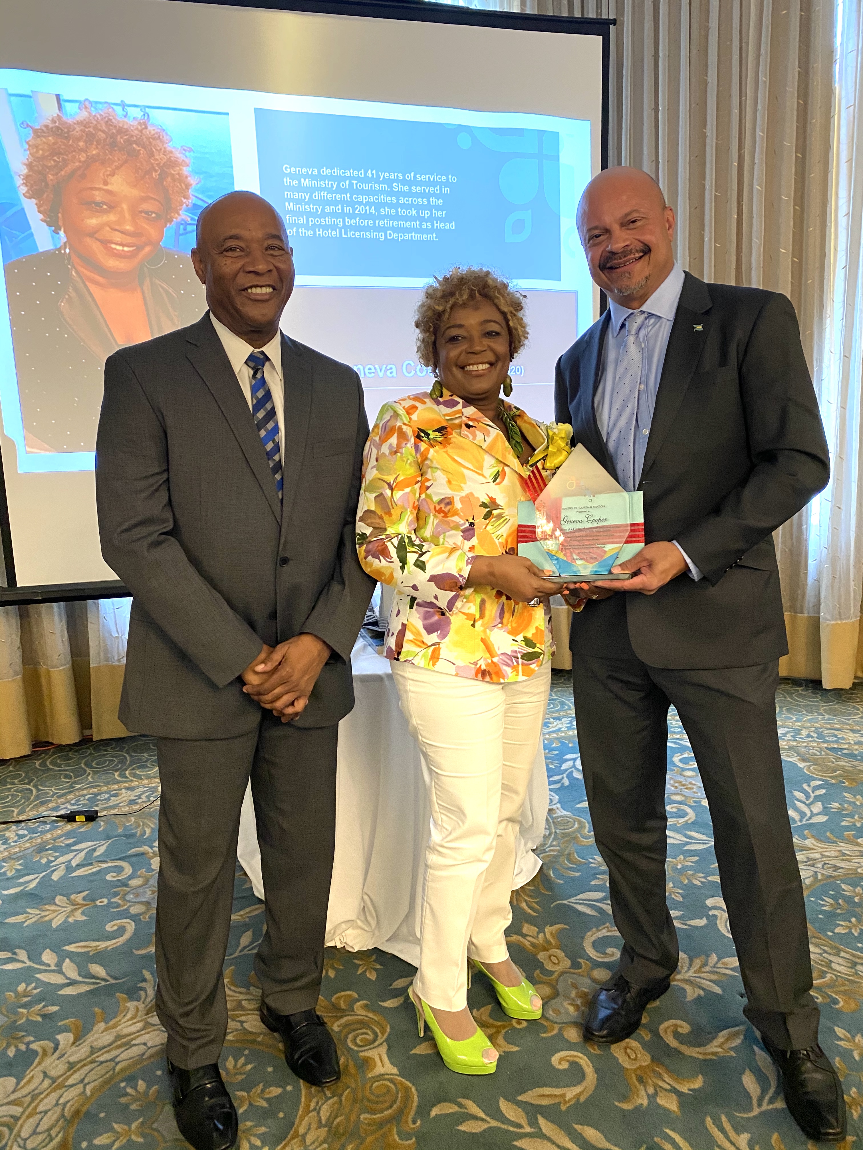 Honouree Geneva Cooper  along with BMOTA Permanent Secretary Charles Albury and Deputy Director General, Ellison "Tommy" Thompson 