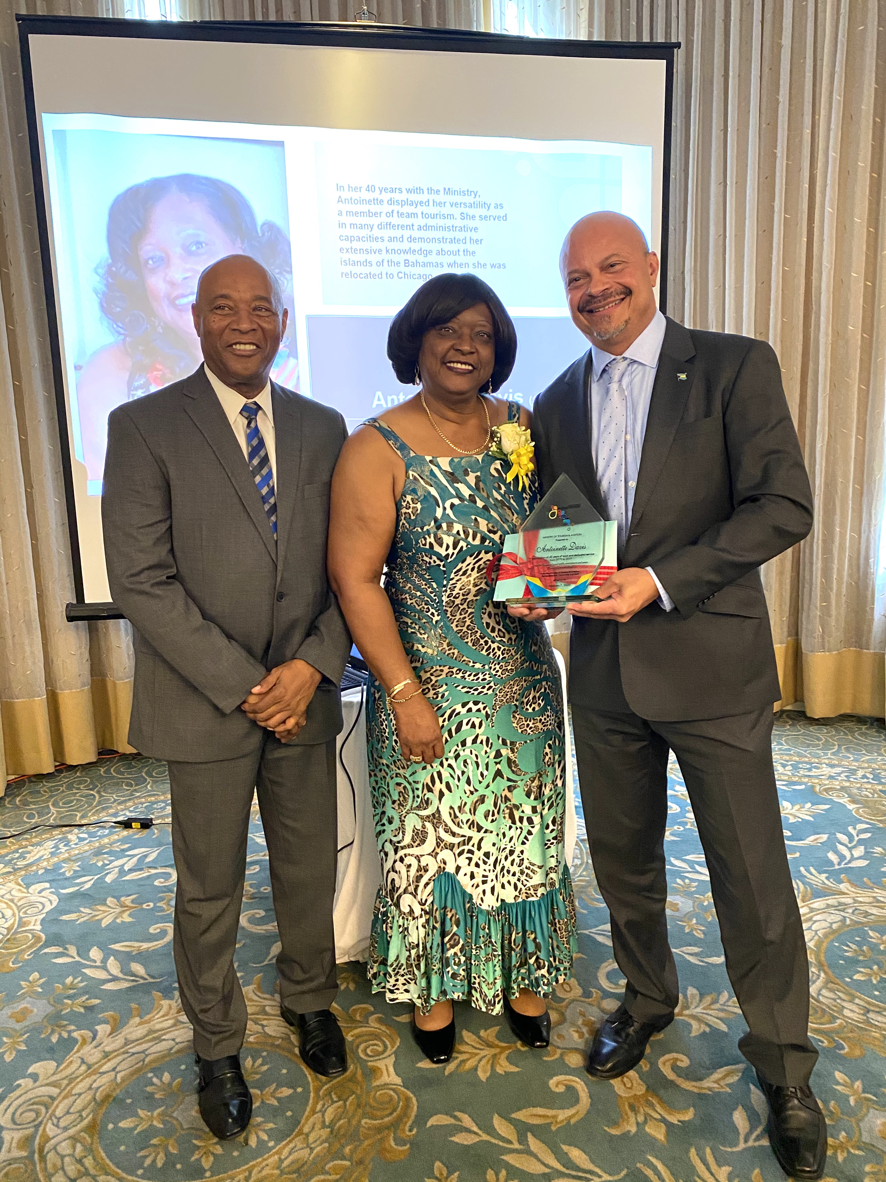 Honouree Antoinette Davis along with BMOTA Permanent Secretary Charles Albury and Deputy Director General, Ellison "Tommy" Thompson 